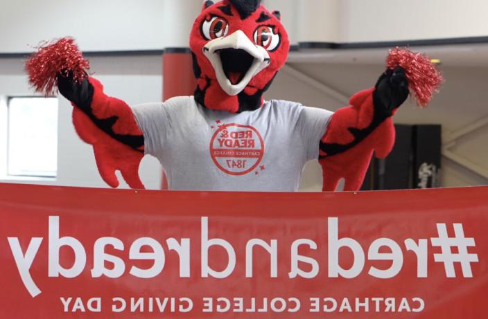 Firdbird Mascot, Ember with the Red and Ready banner.